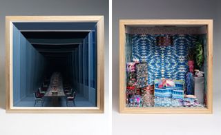 Two side-by-side photos of artistic interpretations of a dolls’ house in square, wooden boxes by several London-based design studios. The first box features blue walls, a table and chair. The space appears to continue further back along with the table and chairs. And the second box features tiled flooring and multicoloured patterned walls. There is also a multicoloured patterned light fixture, sofa and cushions along with other pieces of furniture