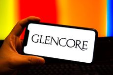 In this photo illustration, a Glencore logo is displayed 