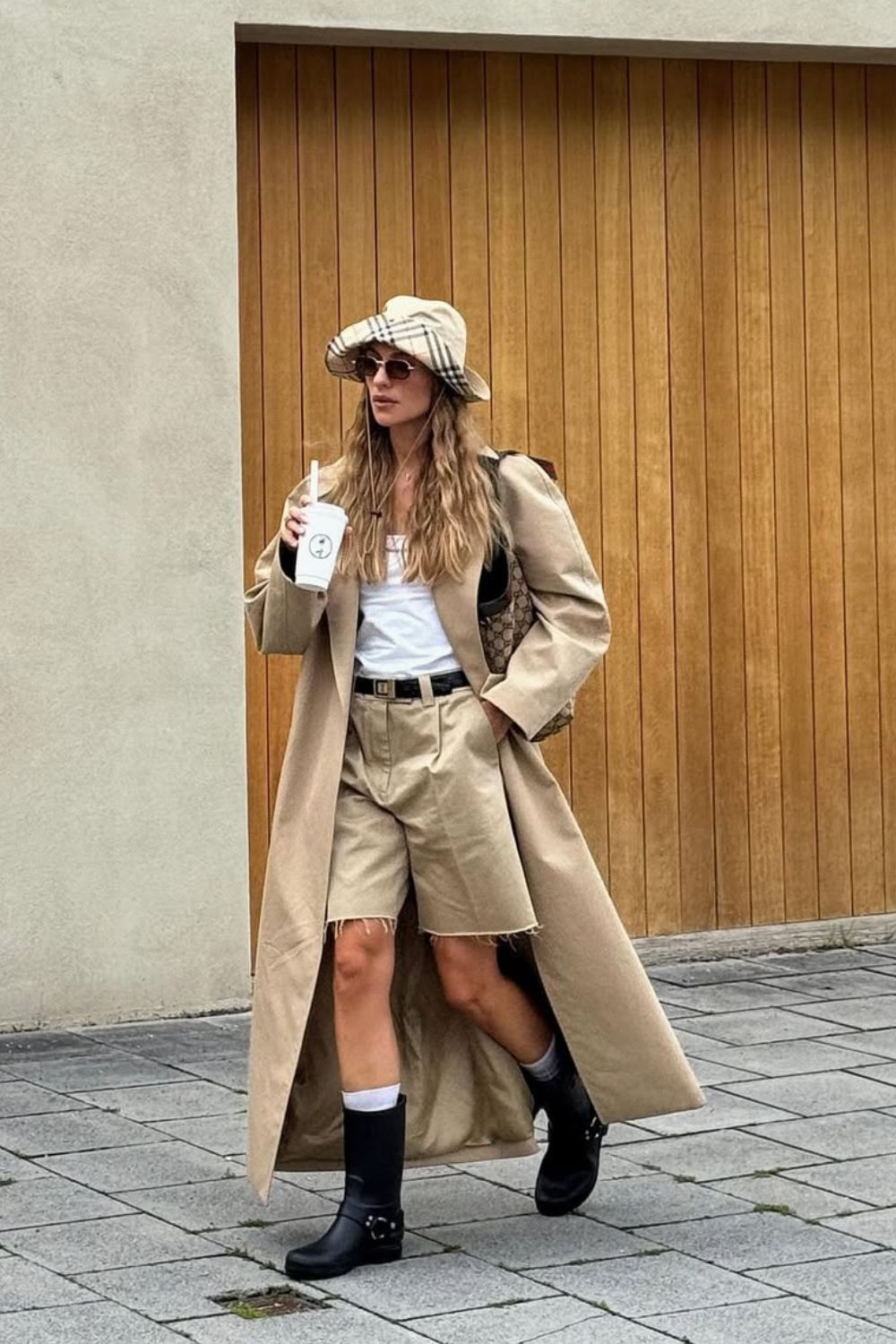 @vikyrader Shorts and Boots outfit wearing a trench coat, tan shorts and biker boots