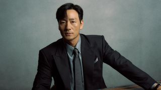 A portrait of actor Park Hae-soo wearing a suit and tie