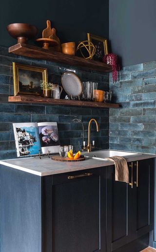 dark blue kitchen with blue tiles