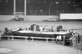 The Beatles, performing at Shea Stadium in Queens, New York on August 23, 1966