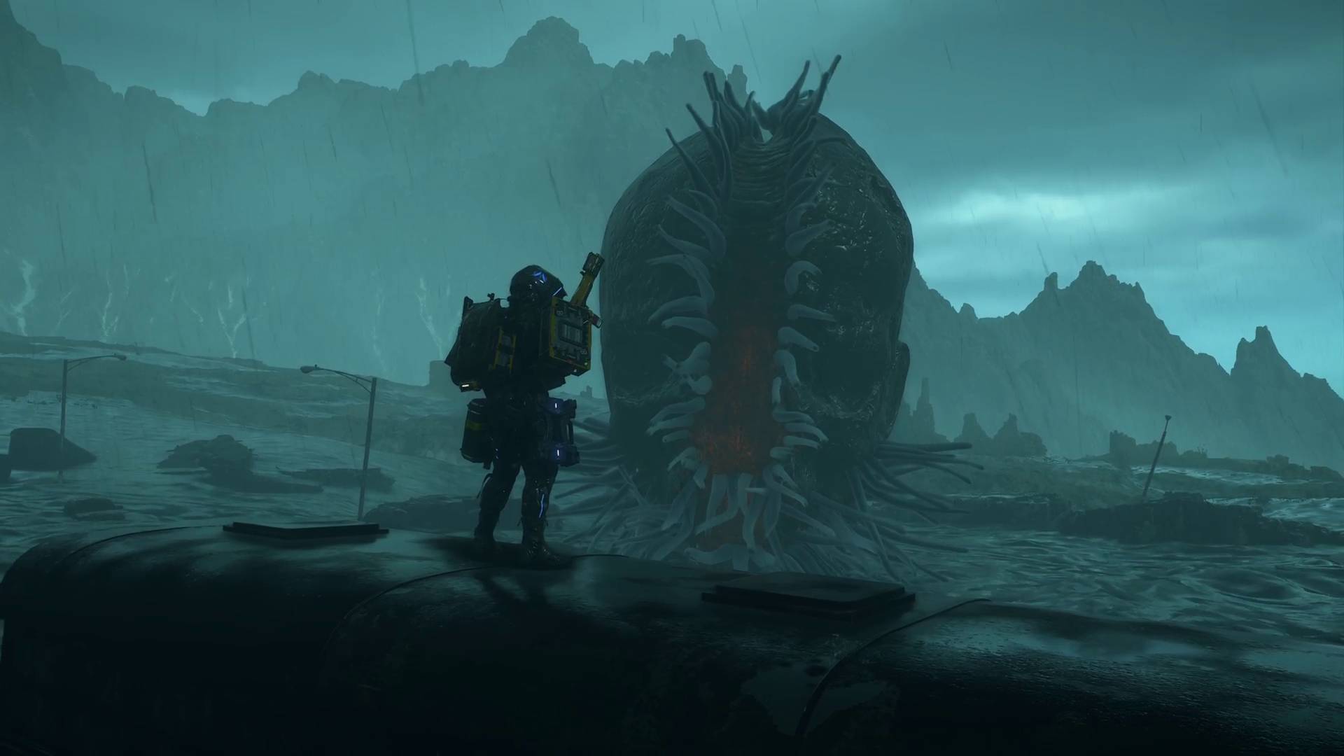 Death Stranding 2 Sam and the big skull BT boss facing off