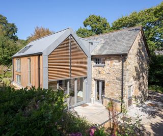 timber clad double height extension with zinc roof