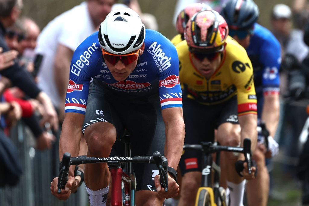 AlpecinDeceuninck teams Dutch rider Mathieu Van Der Poel L and van JumboVisma teams Belgian rider Wout Van Aert R cycle with a pack of riders over the Trouee dArenberg cobblestone sector during the 120th edition of the ParisRoubaix oneday classic cycling race between Compiegne and Roubaix northern France on April 9 2023 Photo by AnneChristine POUJOULAT AFP Photo by ANNECHRISTINE POUJOULATAFP via Getty Images