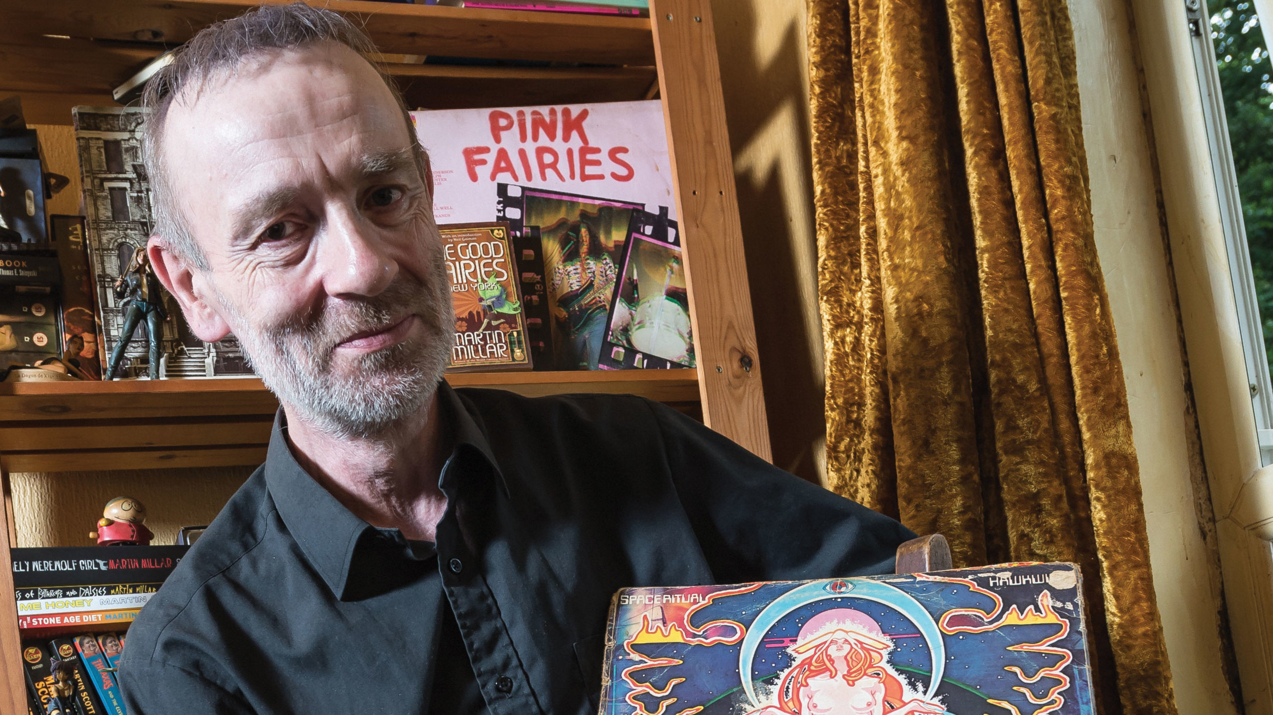 Martin Millar holding up a copy of Hawkwind&#039;s Space Ritual record