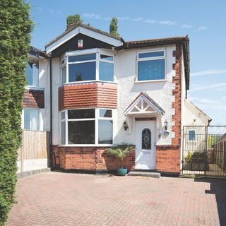 Block paving driveway in front of house