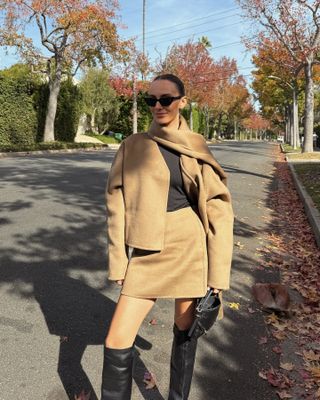 Influencer wearing a camel outfit with knee boots