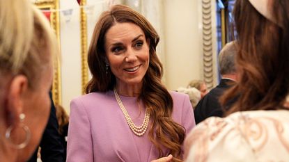 Catherine, Princess of Wales talks with guests as she attends a reception at Buckingham Palace, on the 100th anniversary of the birth of Queen Elizabeth II on April 21, 2026