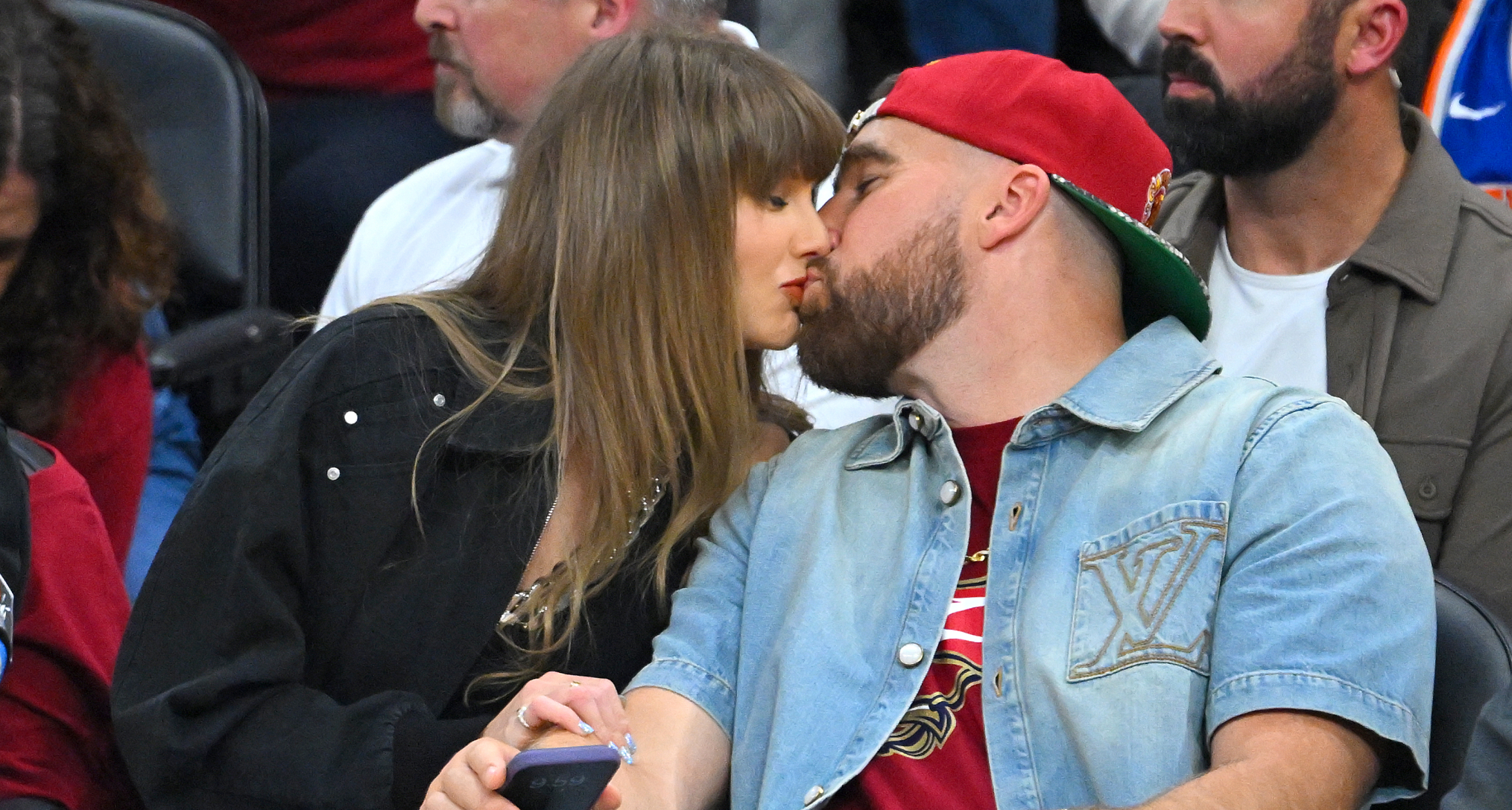 Taylor Swift kissing Travis Kelce
