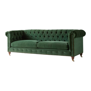 A green Chesterfield style sofa