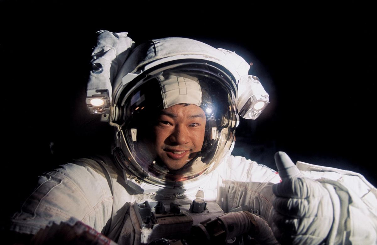 NASA astronaut Leroy Chiao gives a thumbs up signal during a spacewalk outside the International Space Station on Jan. 17, 1996.