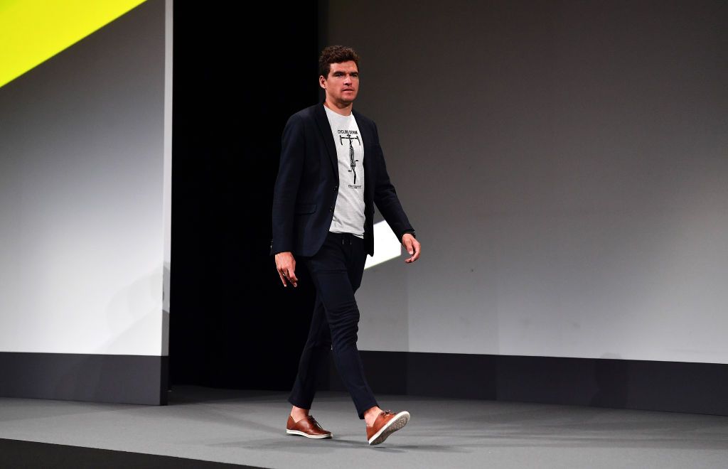 Greg Van Avermaet walks onto the stage
