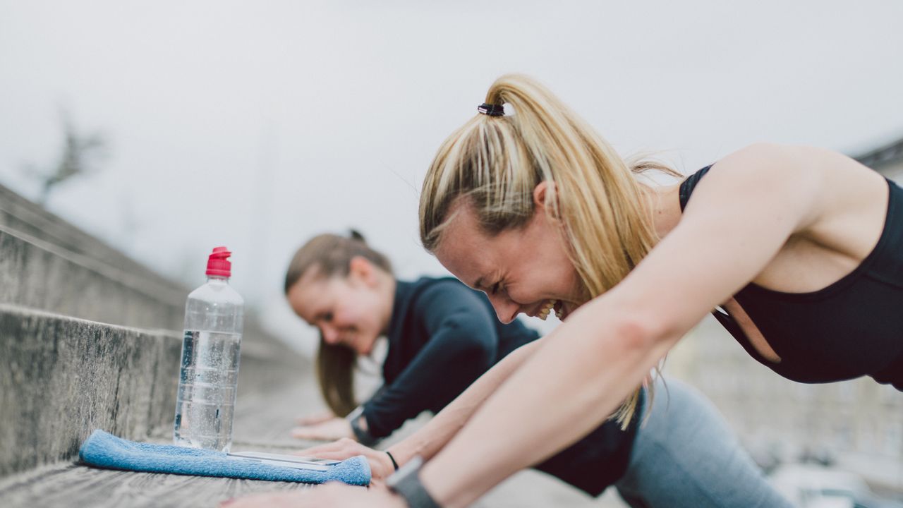 Women doing push-ups to &quot;gamify&quot; their workouts