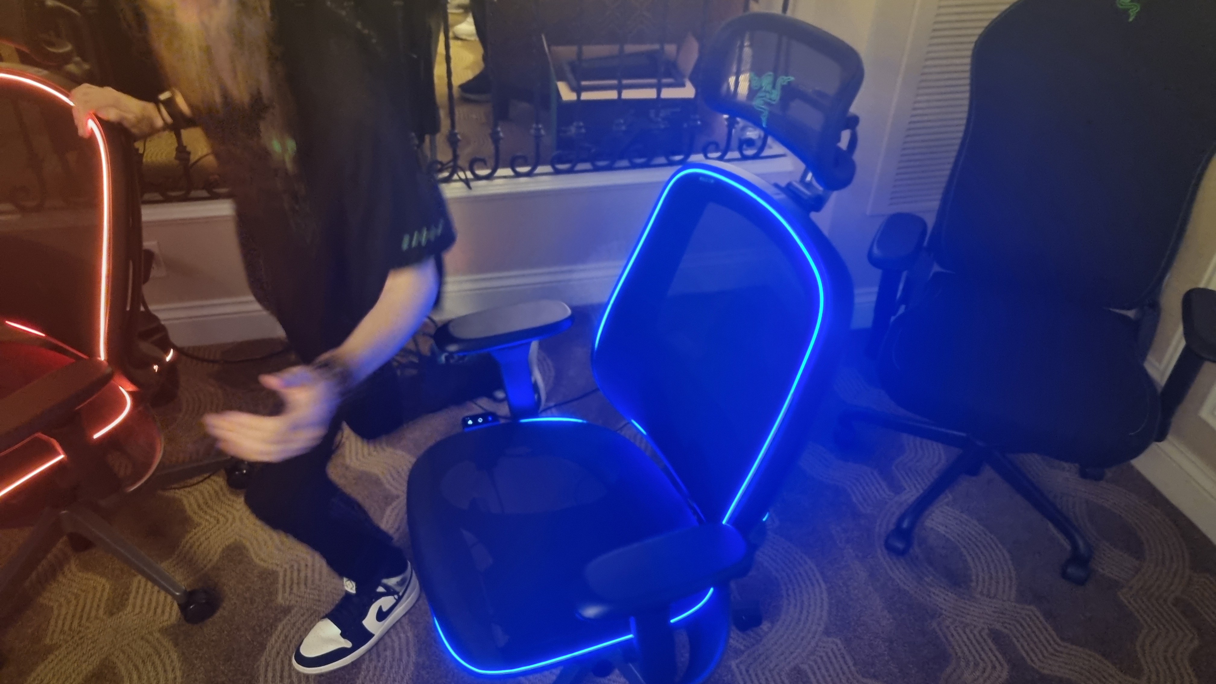 The Razer Project Arielle gaming chair, lit up in either red or blue.