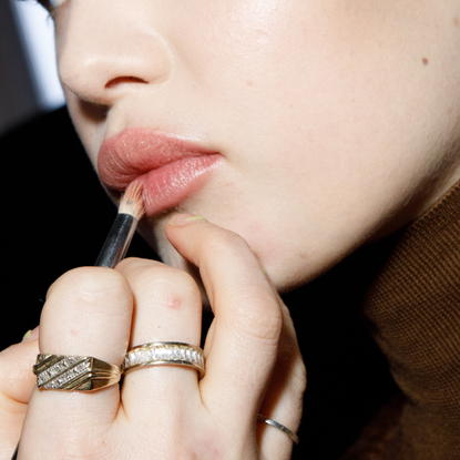 Liv Walters, make up detail, is seen during the make up backstage at the Max Mara fashion show during the Milan Fashion Week Womenswear Fall/Winter 2023/2024 on February 23, 2023 in Milan, Italy. 