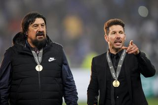 Atletico Madrid manager Diego Simeone and assistant manager German Burgos with their Europa League winner's medals, 2018