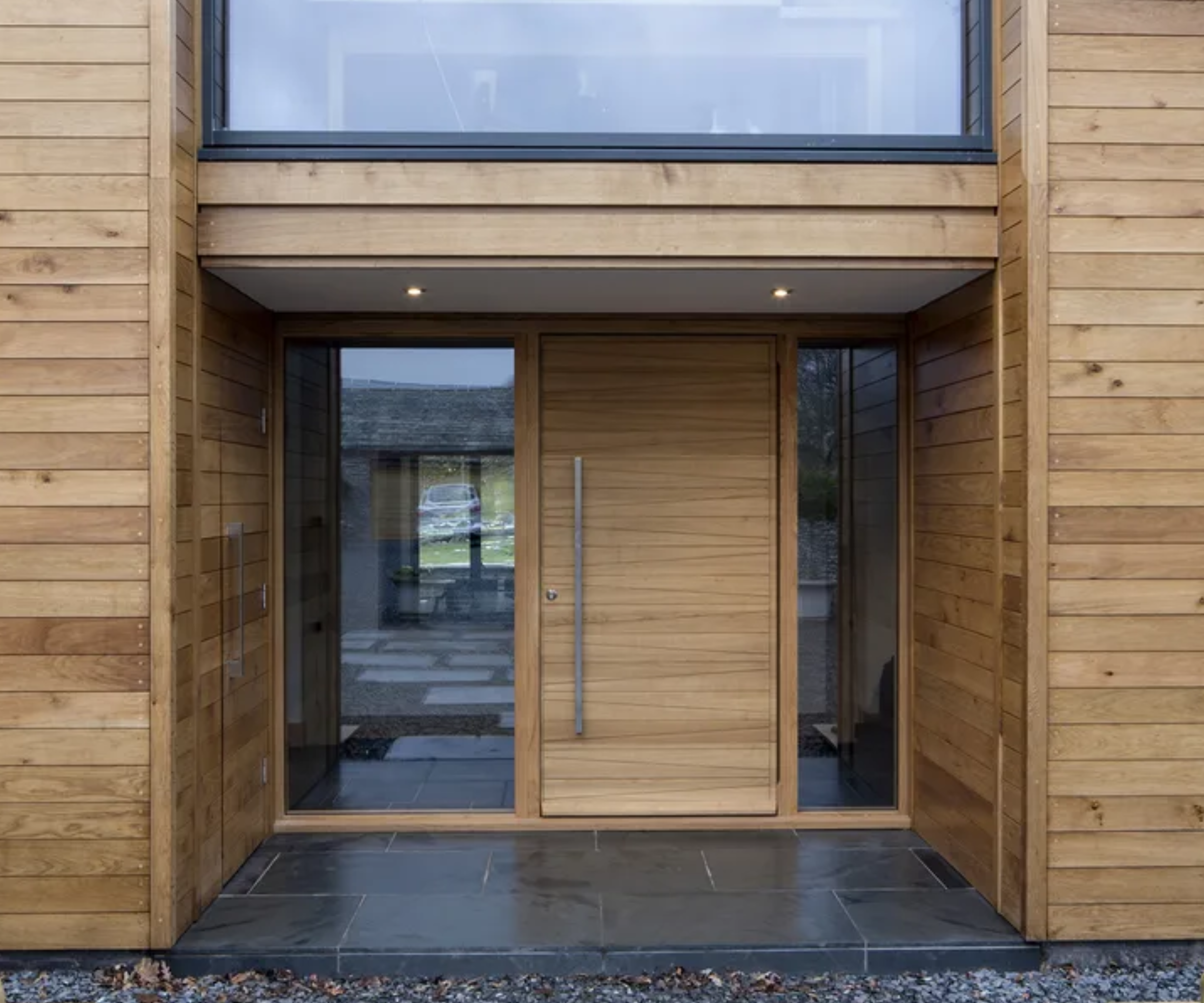 Wooden front porch with spotlights