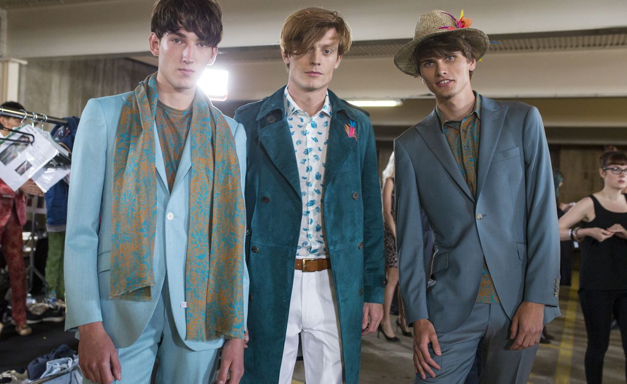 Male models wearing the Richard James collection for Spring / Summer 2016 with stylised colorful hibiscus blooms from deep within the Mexican jungle