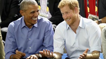 : Former U.S. President Barack Obama and Prince Harry share a joke as they watch wheelchair baskeball on day 7 of the Invictus Games 2017 on September 29, 2017 in Toronto, Canada