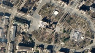 This photo, taken by a Planet satellite on March 21, 2022, shows a destroyed theater in the Ukrainian city of Mariupol. The Russian world for "children" is written in white outside the theater.