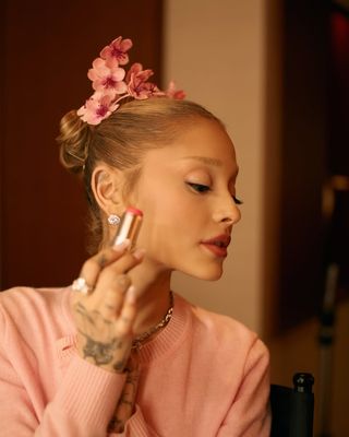 A photo of Grande sporting a new launch from her beauty brand on her lips and cheeks.