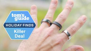 A hand wearing three popular smart ring models