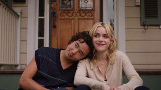 Kiernan Shipka and Nico Hiraga sit on a stoop in Sweethearts