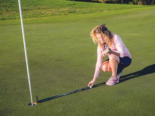 Golf Monthly Top 50 Coach Katie Dawkins demonstrating the shadow putting game