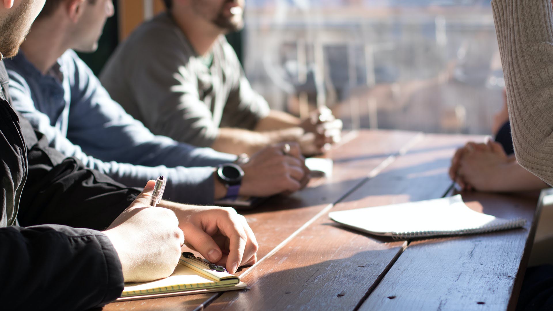 People discussing a plan in an office setting