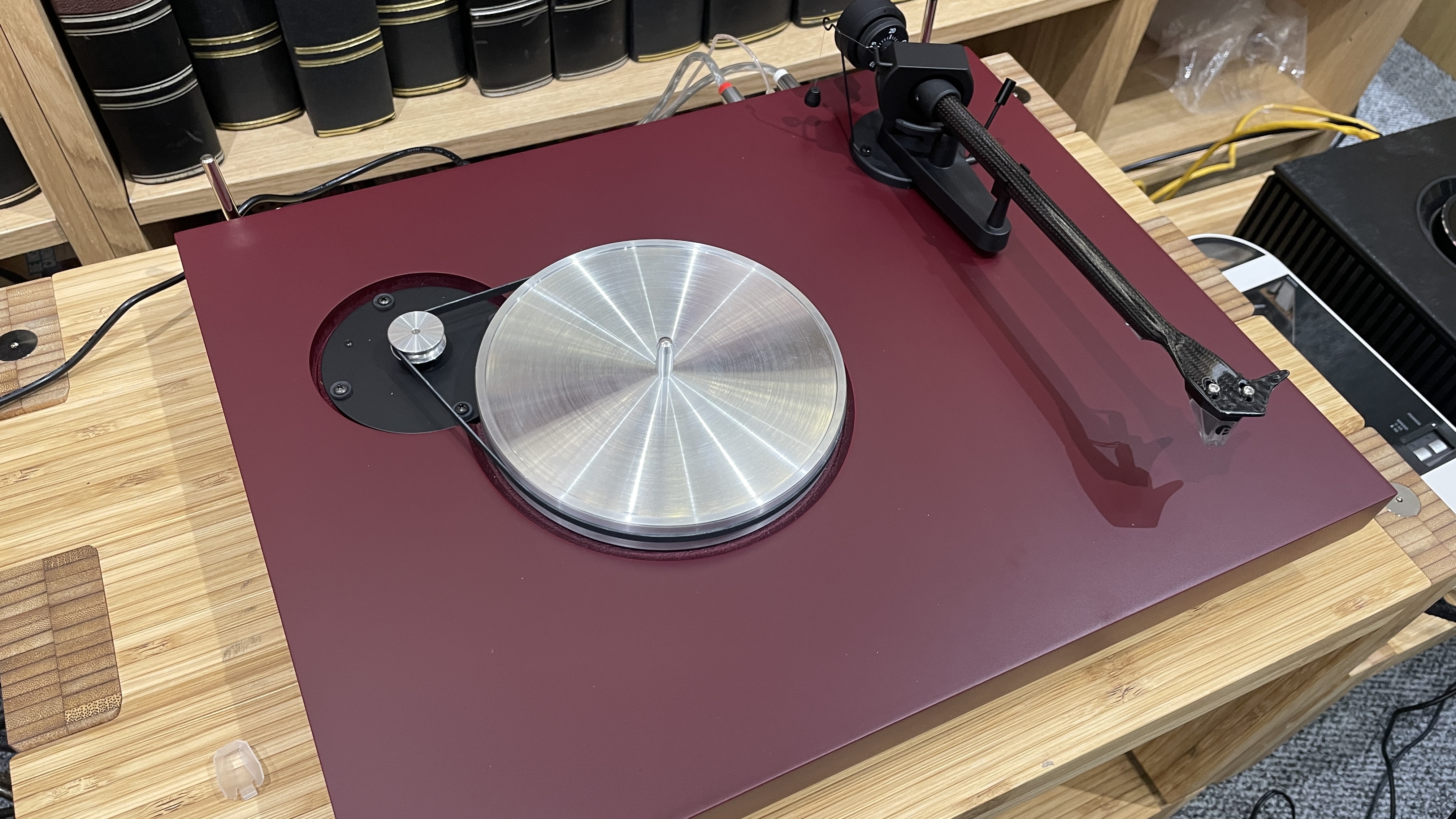 Pro-Ject Debut Evo 2 turntable on wooden rack