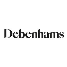 Model wearing a beige trenchcoat, white top, wide leg trousers and heels sold at Debenhams standing on a pavement