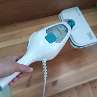 The Black & Decker 10-in-1 Steam Mop in use as seen from a first person perspective