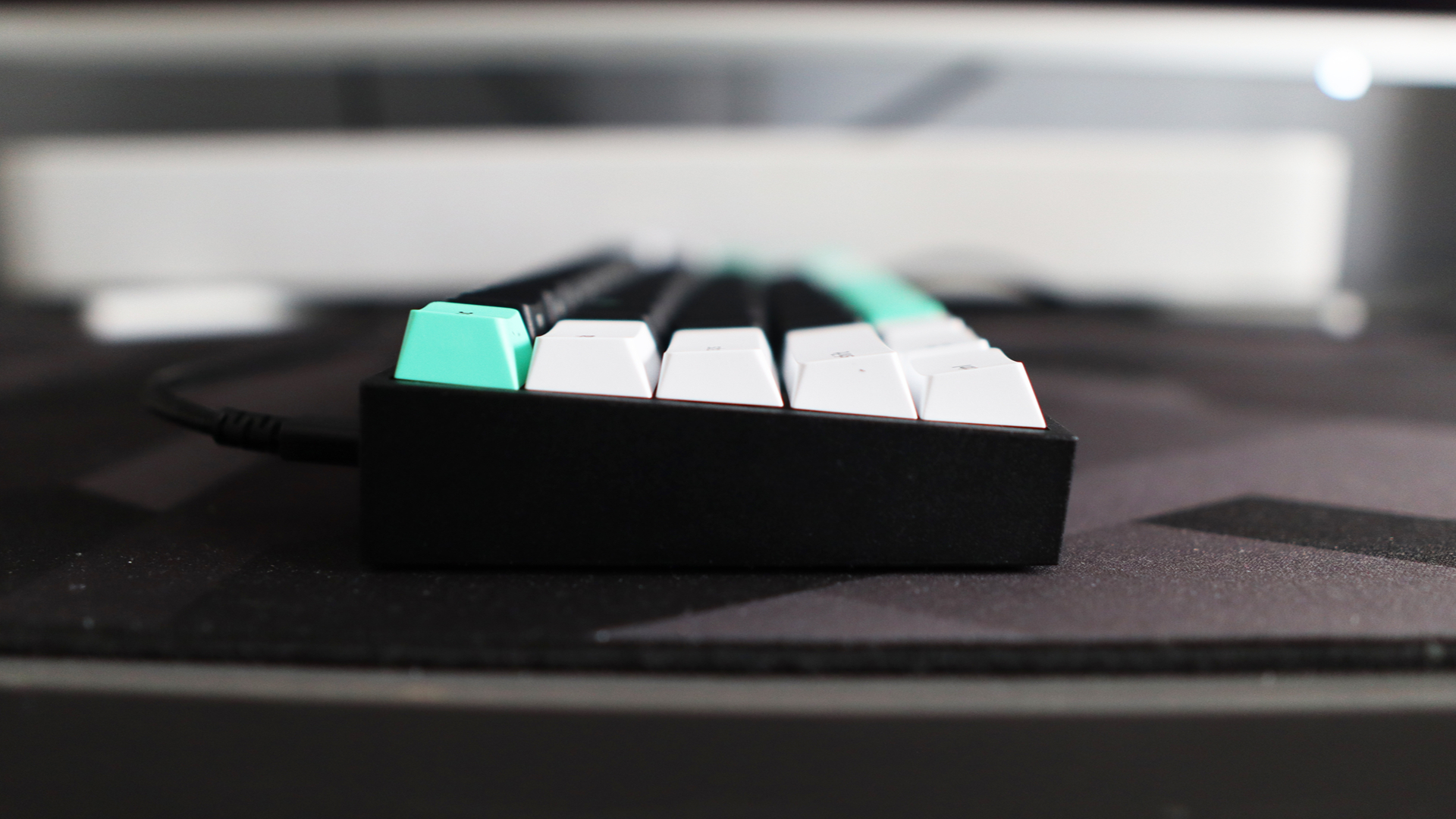 Razer Reclusa X Mini 65% keyboard on a desk