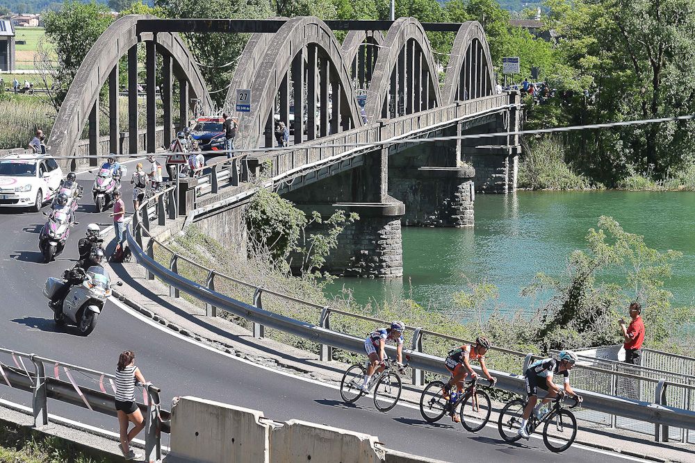 The breakaway crosses a bridge during stage 17.