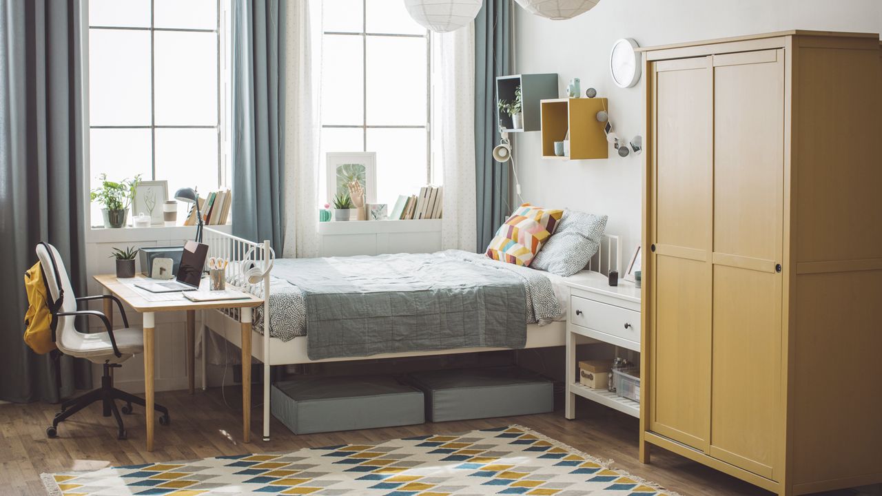 Clean dorm room with made up bed