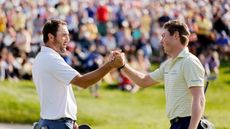Scottie Scheffler and Ben Griffin shake hands after round four of the 2025 Memorial Tournament