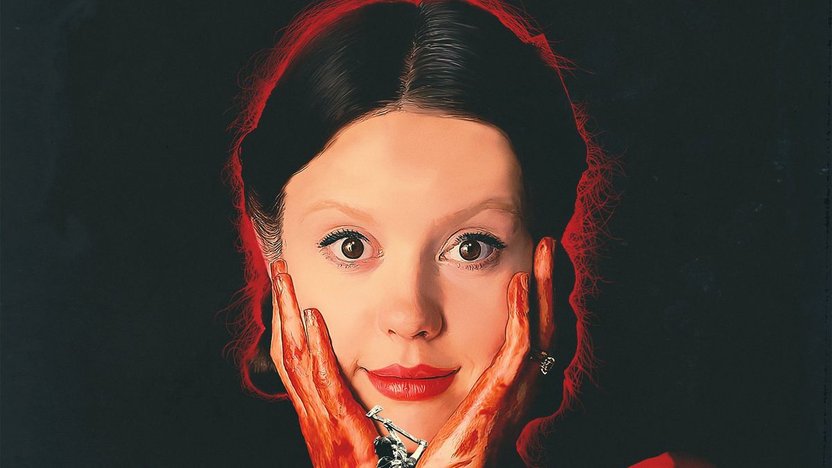 Mia Goth, holding bloody hands to her face while smiling, as Pearl, in the poster for Pearl.