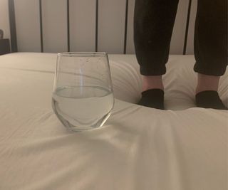 Testing motion transfer on the emma original mattress with a part glass or water