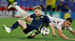 Hungary's Willi Orban challenghes Scotland''s Stuart Armstrong during the teams' Group A clash at Euro 2024.