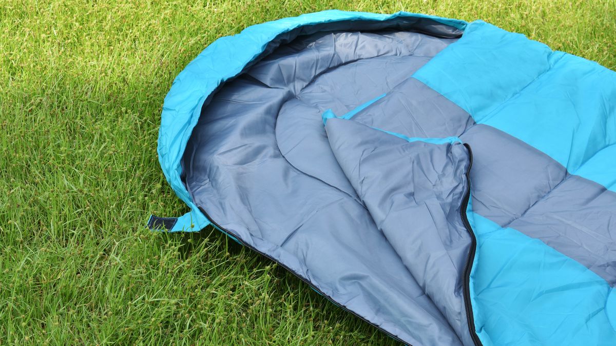 Light blue sleeping bag on grass