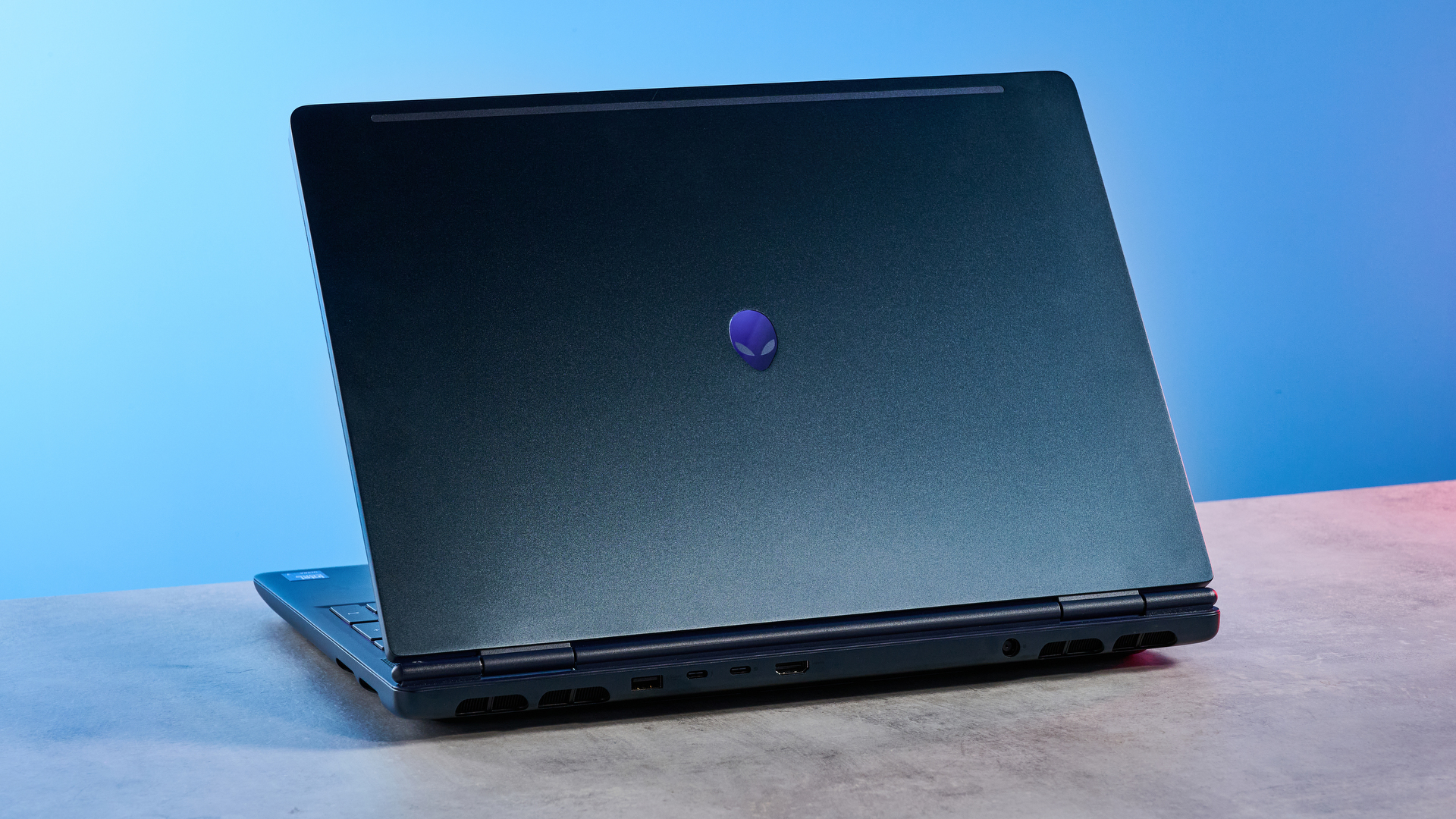 A blue Alienware 16X Aurora gaming laptop
