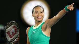China's Zheng Qinwen, wearing a green top, smiles after making it to the Australian Open women's final – 