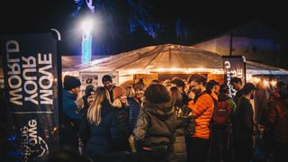 Party goers gather at night at the Kendal Mountain Festival