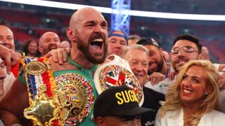 Tyson Fury celebrates with wife Paris