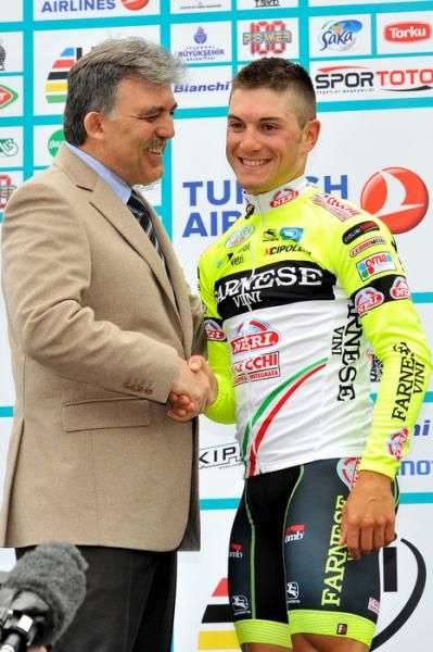 Andrea Guardini is congratulated on his stage win by Turkey's president.