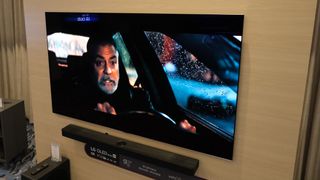 LG G5 OLED TV on display at CES 2025 with George Clooney on screen