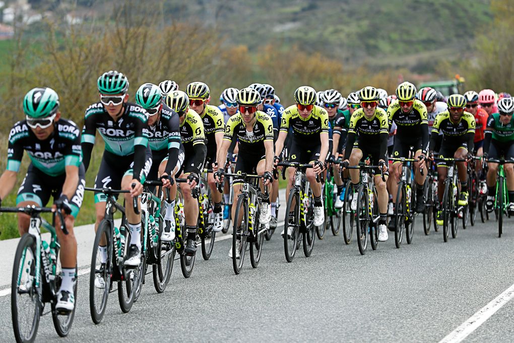 Adam Yates is talked in amongst his Mitchelton-Scott teammates at Tour of the Basque Country