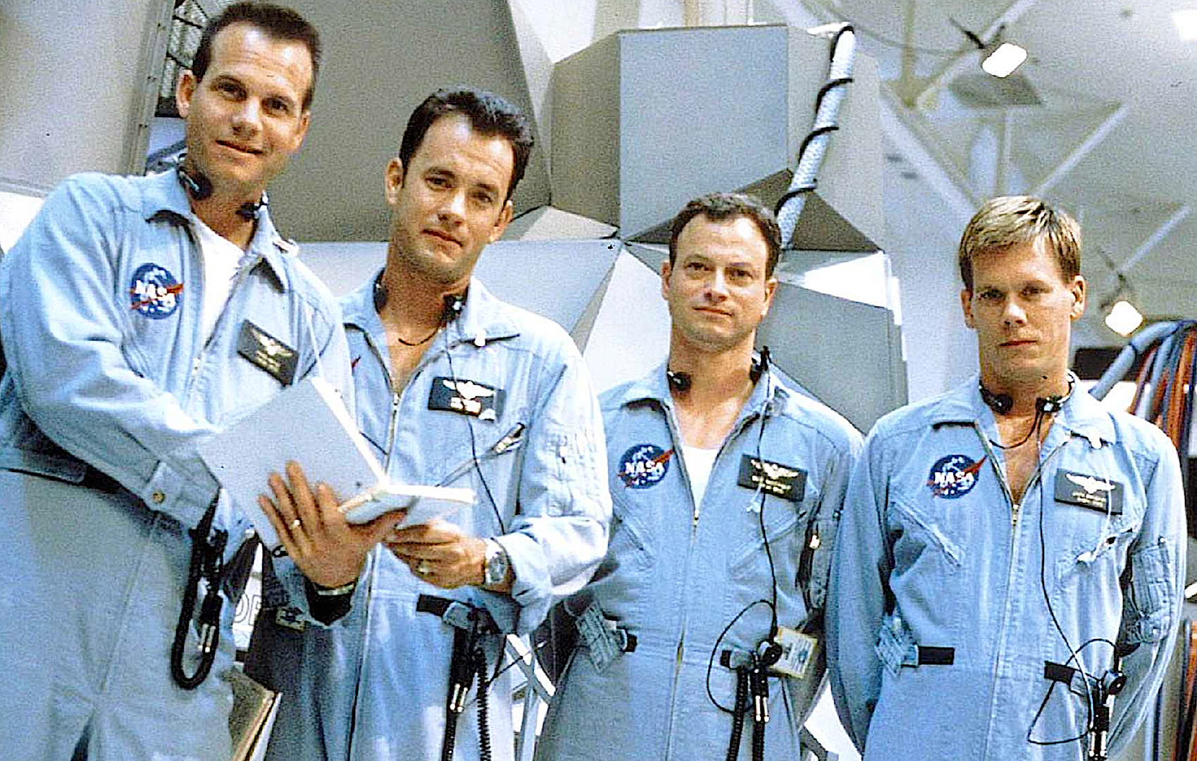 Fours actors in blue astronaut flight suits