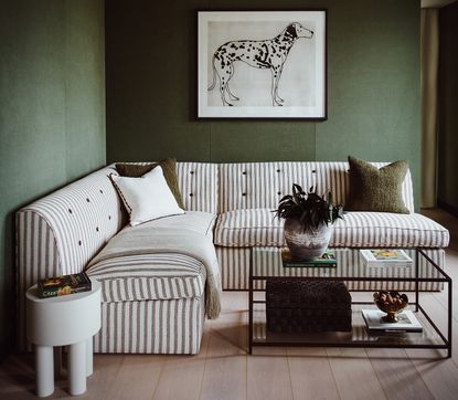 green living room with stripy sofa